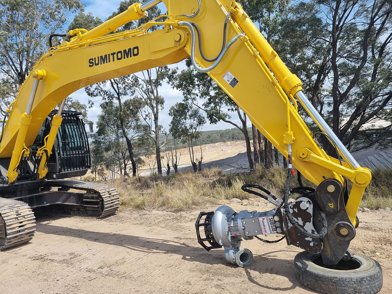 Dredge pump connected to excavator showing extended arm picture
